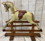VICTORIAN CARVED WOOD & PAINTED ROCKING HORSE, possibly G & J Lines, with leather saddle on a