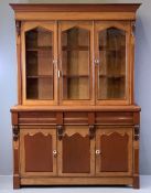 VICTORIAN GLAZED TOP CWPWRDD GWYDIR in oak and mahogany, having a stepped cornice over two arched