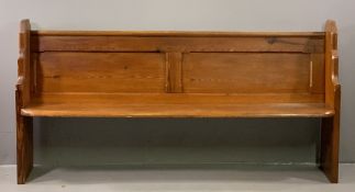 VINTAGE PITCH PINE CHURCH PEW with shaped supports, one numbered '26' with open base and panelled