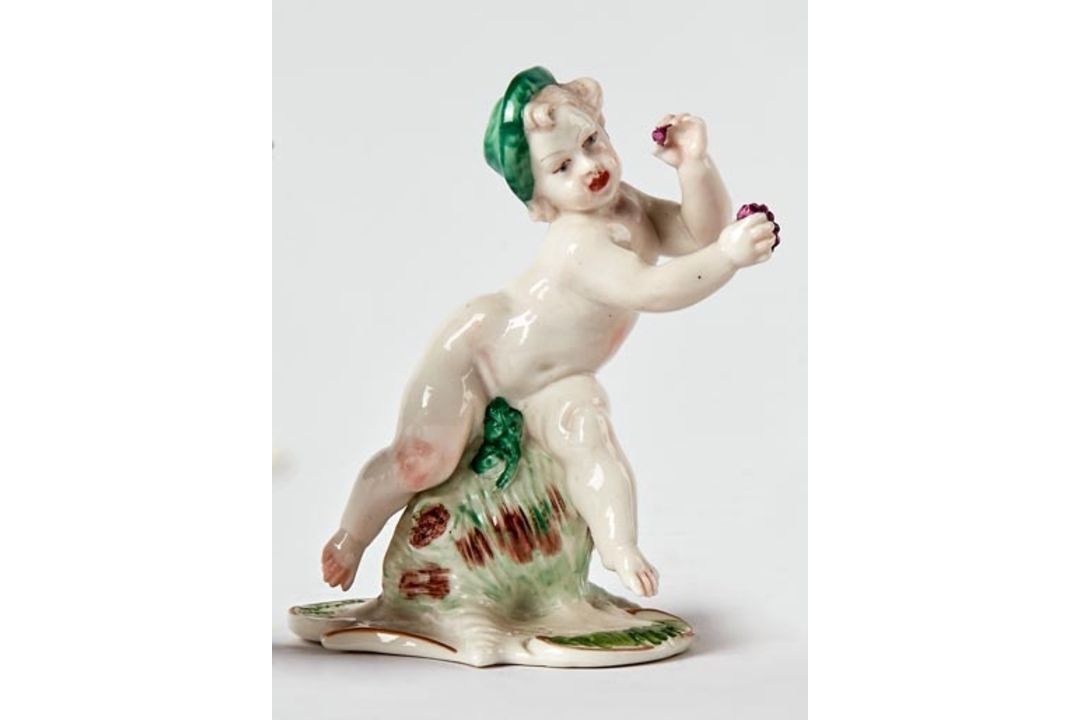 Putto mit Trauben als Hermes bzw.