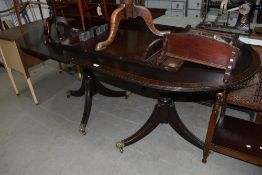 A reproduction Regency extending dining table