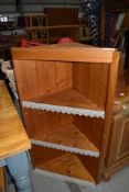 A natural pine corner shelf