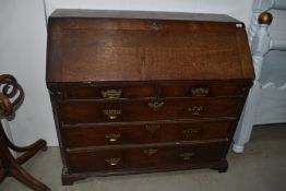 A period oak bureau, damage to back leg, bit rough around the edges but been a nice piece in its