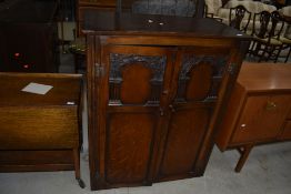 A Priory style oak small robe, approx. 88cm width, height 107cm