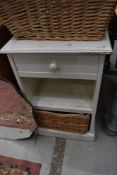 A painted bathroom shelf with underbasket