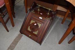 A Victorian mahogany and brass coal purdonium
