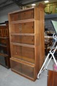 A vintage Simplex stacking bookcase in light mahogany, 5 tiers, overall dimensions approx. H182cm