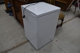 A small chest freezer, labelled 95L