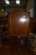 An Edwardian mahogany and inlaid pot cupboard