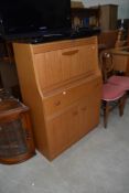 A vintage laminate teak effect bureau, width approx. 79cm