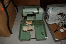 An Elna supermatic apple green sewing machine for haberdashery or dress making