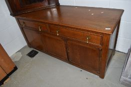 An early 20th Century oak sideboard or dresser base, width approx. 135 height 63cm