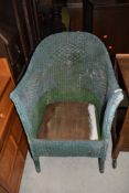 A traditional Lloyd Loom tub chair (no seat)