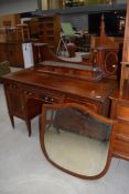 An early 20th Century mahogany and inlaid dressing table, labelled and stamped Maple and Co, width