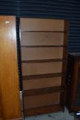 A stained frame waterfall style bookcase