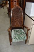 An early 20th Century cane back armchair