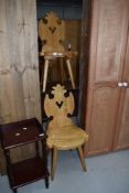 A pair of vintage pine shield back hall chairs
