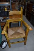 A heavy rush seated carver chair