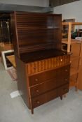 A vintage mahogany dresser of stylised form having display shelf back over three drawers, the top