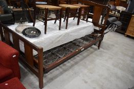 An early 20th Century mahogany bed frame (138cm - 4ft6) , by Staples and Co, with sprung base ,