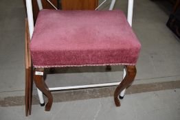 A traditional dressing table stool having dralon upholstered stuffed seat on cabriole legs