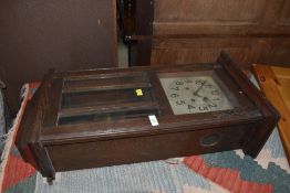An early 20th Century oak cased wall clock