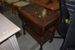 A Priory style oak tea trolley