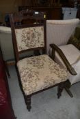 A Victorian mahogany dining chair having overstuffed seat and back and later upholstery