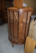A mid 20th Century walnut bow fronted display cabinet, dimenstions approx. W74cm D34cm H125cm