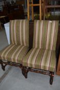 A pair of Period turned frame dining chairs having later upholstery