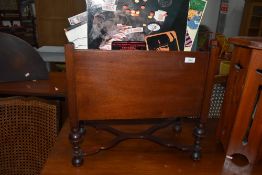 A reproduction Victorian style mahogany canterbury containing a selection of LP records, mainly