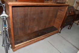 A vintage pine bookcase, of large proportions, width approx. 183cm, height 115cm