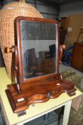 A Victorian mahogany toilet mirror on shaped base and scroll feet, width approx. 50cm