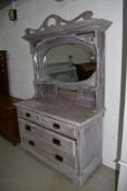 A ' shabby chic' mirror back small sideboard/dressing table having two over two drawers, width