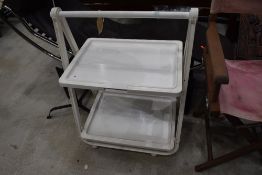 A white plastic folding trolley