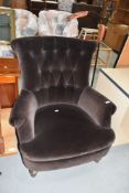A vintage brown dralon easy chair