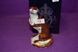 A Royal Crown Derby paperweight Playful Otter with a Gold stopper