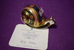A Royal Crown Derby paperweight Garden Snail with gold stopper and certificate