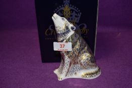 A Royal Crown Derby paperweight Wolf, boxed with a gold stopper
