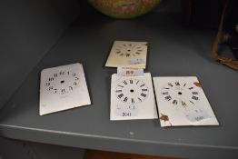 A selection of enamel French and similar carriage clock faces or dials