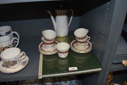 A selection of tea cups and saucers having red and gilt design and similar Windsor coffee pot