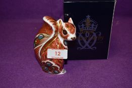 A Royal Crown Derby paperweight Woodland Squirrel with a Gold stopper