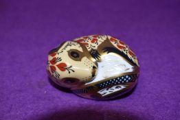 A Royal Crown Derby paperweight Sleeping Dormouse, with silver stopper