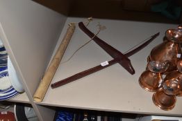 A small naive native crossbow and arrow in quiver