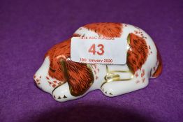 A Royal Crown Derby paperweights Puppy, with gold stoppers