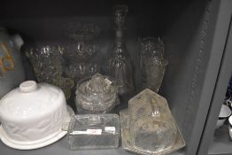 A selection of clear cut glass wares including large cheese dome and blown decanter