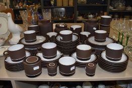 Around sixty two pieces of Hornsea pottery contrast.