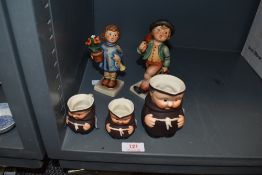 A selection of figurines by Goebel including monk jugs