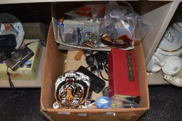 A box full of miscellaneous items,keyrings ,coins,books including annuals and more.