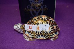 A Royal Crown Derby paperweight Indian Star Tortoise, boxed with a gold stopper